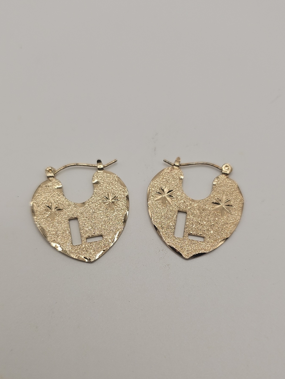 Gold Tone Flat Earrings with Starburst Detail